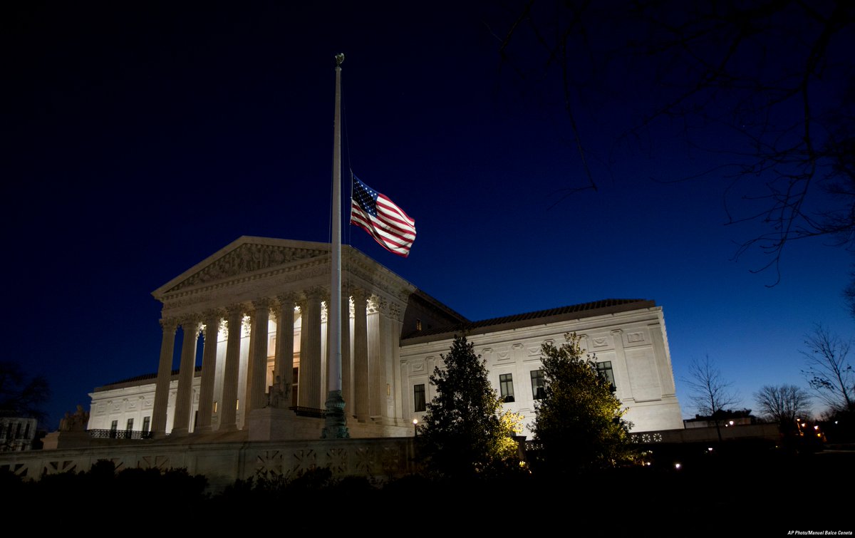 FoxNews's tweet image. An American flag flies at half-staff in front of the Supreme Court in honor of Justice Scalia as the sun rises.