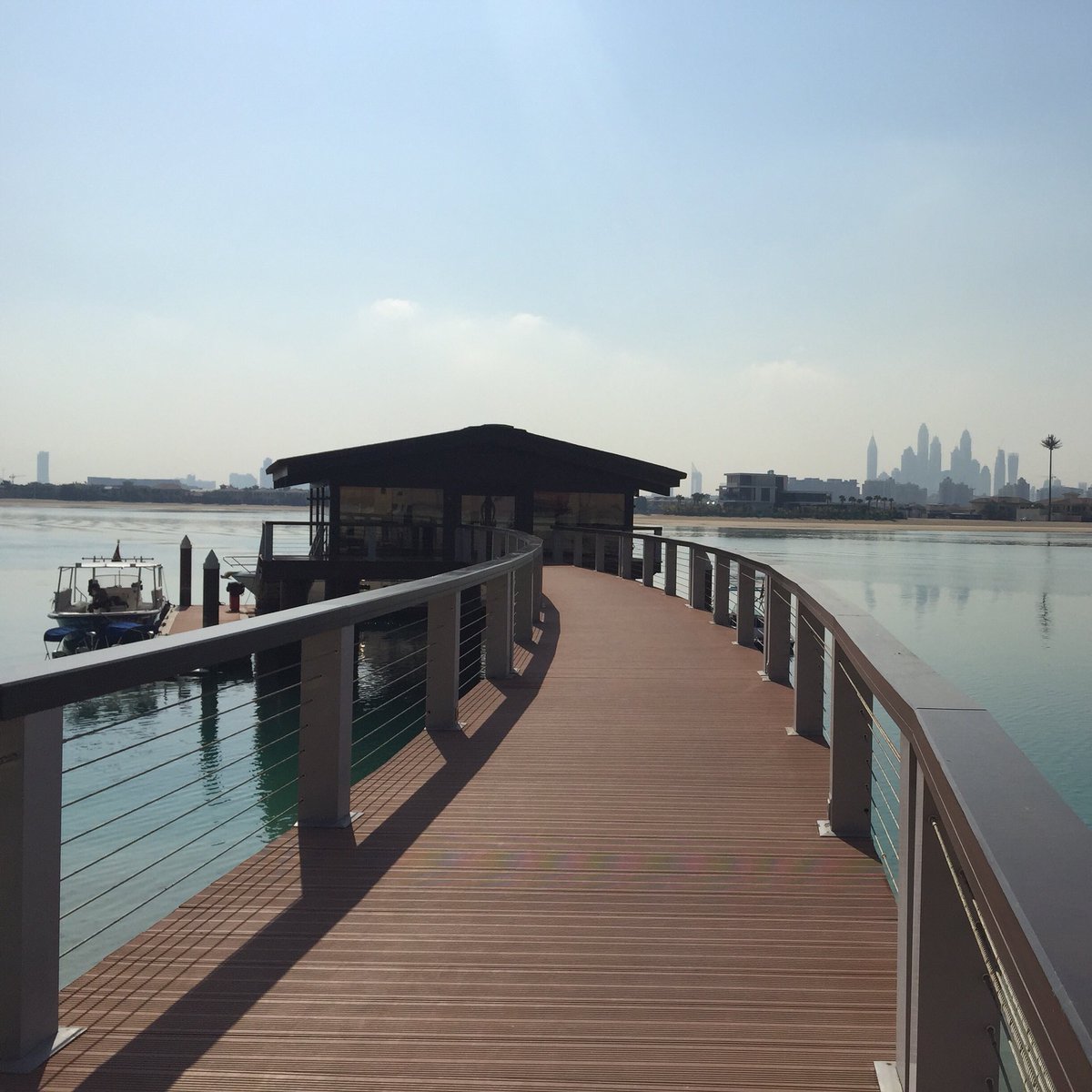 AdvancedIFA's tweet photo. Blue Sky and bright sunshine ☀️☀️☀️on the boat jetty with @ForGoodAli @JamesNewham @joenewham9 #sofiteldubaipalm https://t.co/pJcvt3bXZ3