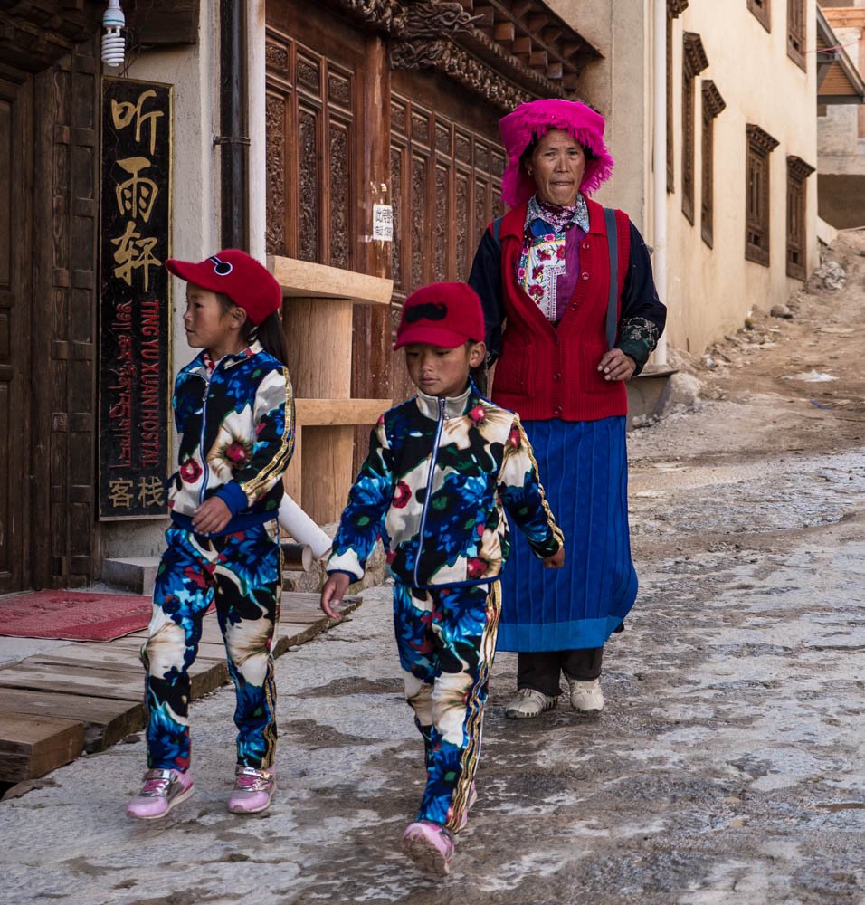 She sells shell suits in Shangri La. Street style in the capital of Diqing Tibetan Autonomous Region, north Yunnan