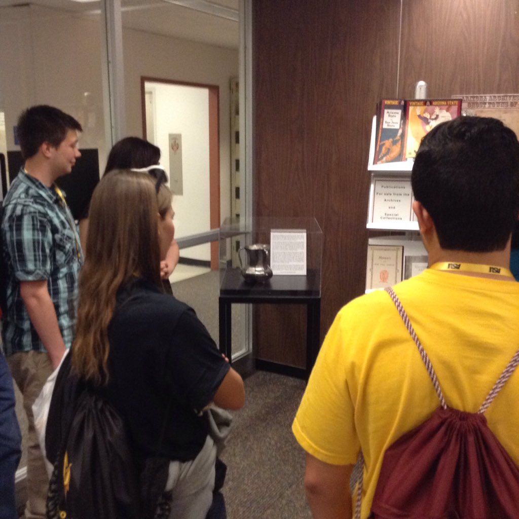ASULibraries's tweet photo. Prospective Sun Devils getting a look at the original Territorial Cup on their #asulibraries tour. #MoreASU https://t.co/rRNcgStlmh