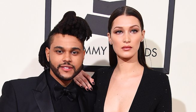 MTVUK's tweet photo. How cute are @bellahadid and @theweeknd being all coupley on the #GRAMMYs red carpet? https://t.co/ev5jCWVfqt https://t.co/q27mRvMEVk