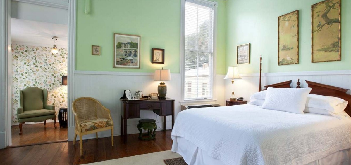 Room 4 is a parlor level room with queen size bed, beautiful bath &amp; spacious sun room that opens to the courtyard.