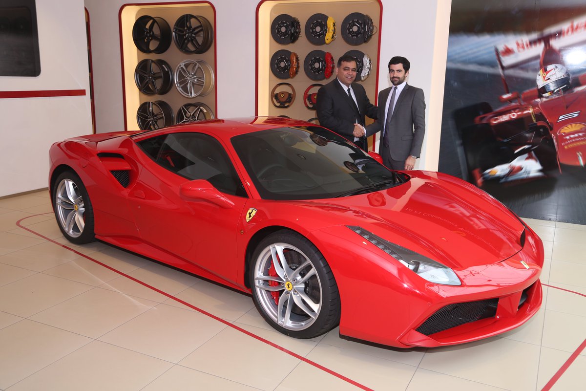 YogenPratap's tweet photo. #488GTB unveiled by A Sauvard, dir-sales, @Ferrari #MEA&amp;India &amp; Yadur Kapur, dir, #selectcars at its launch in Delhi https://t.co/eoq4M8Op7V
