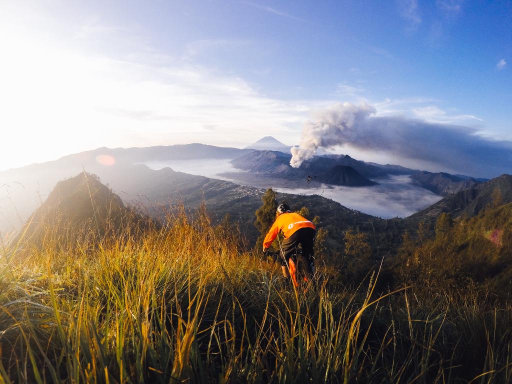 GoPro's tweet photo. Photo of the Day! @KurtSorge + @solosproduction shred an early morning line in the shadow of #MtBromo! #GoPro https://t.co/iqxf4abfhv