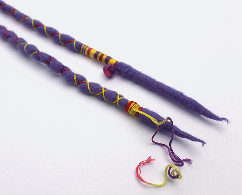 h_h_handcrafted's tweet photo. Purple clip-in wool dreadlocks with red/yellow/green accents &amp; a purple bead! 💜 Available @ https://t.co/8OC1IhVeq0 https://t.co/nCFng4he5x