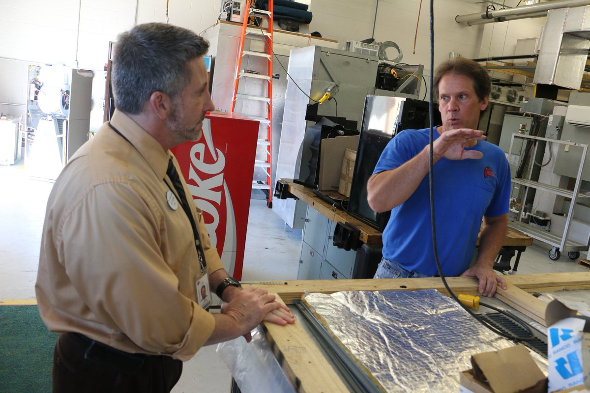 CitFoodServices's tweet photo. FNS Director Roy Pistone w/ HV/AC program instructor Jim Gerlach discuss a piece of equipment with WTC students. https://t.co/Rk9R942roz