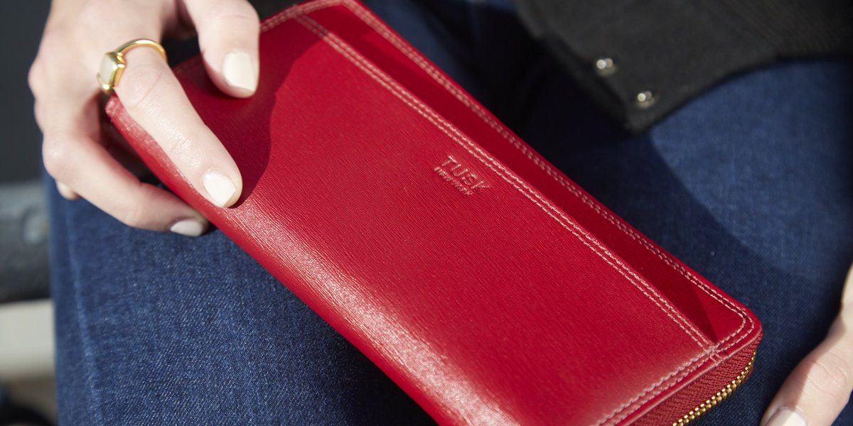 Shop the single zip wallet with fun details (tusk pulls, quilted stitching, tassels) here: tusk.com/?s=301&post_ty…