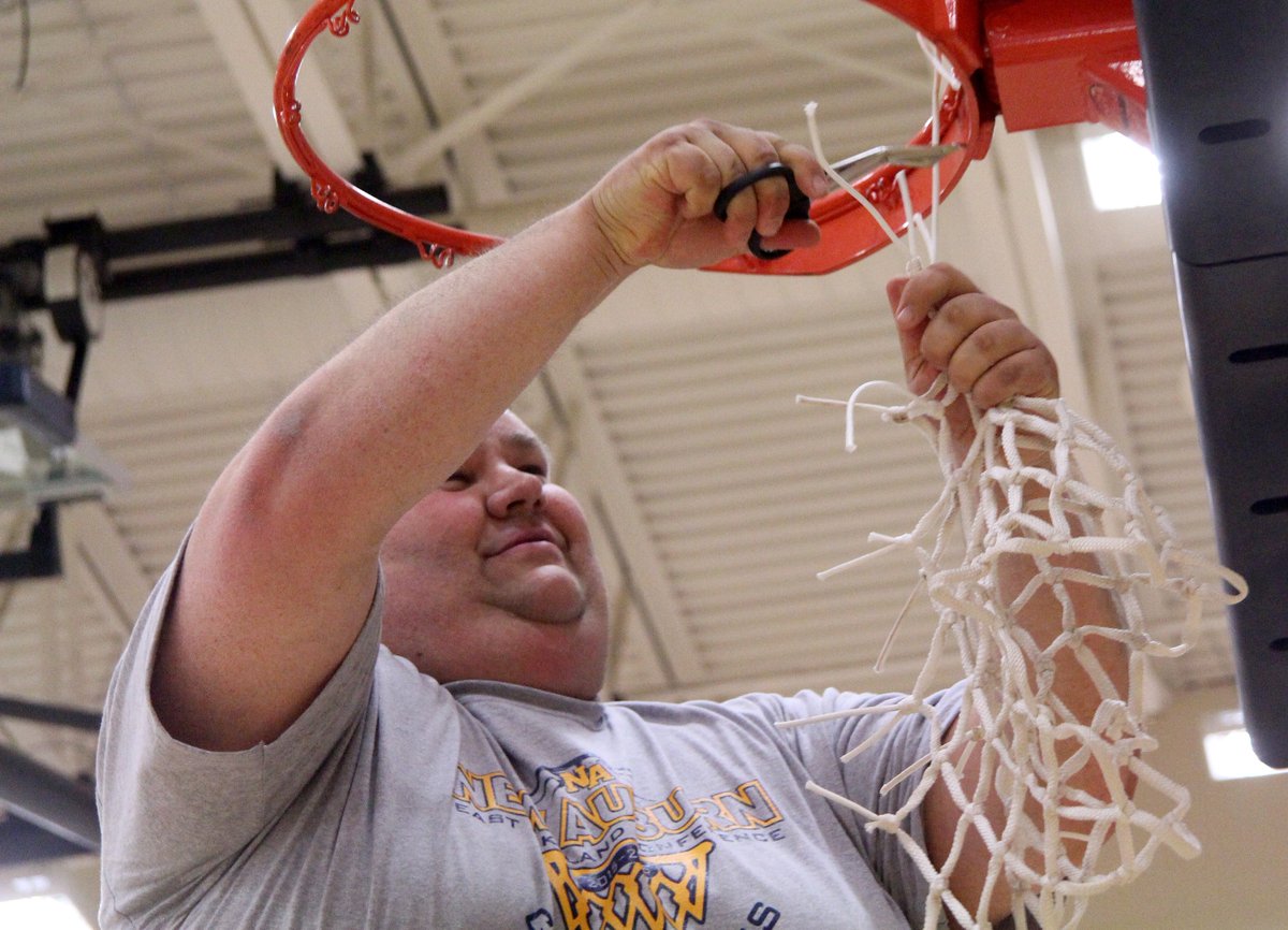 brandon_berg's tweet photo. Photo: New Auburn coach Keenan Dahl cuts down the net after his team clinched its second straight conference title. https://t.co/UHaICFrAk2