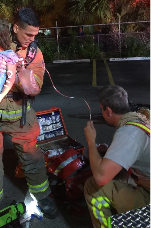MiamiDadeFire's tweet photo. #MDFR crews rescued a child from a fire last night. Saving a life is the reason why firefighters risk their own. https://t.co/XhnMNutoYR
