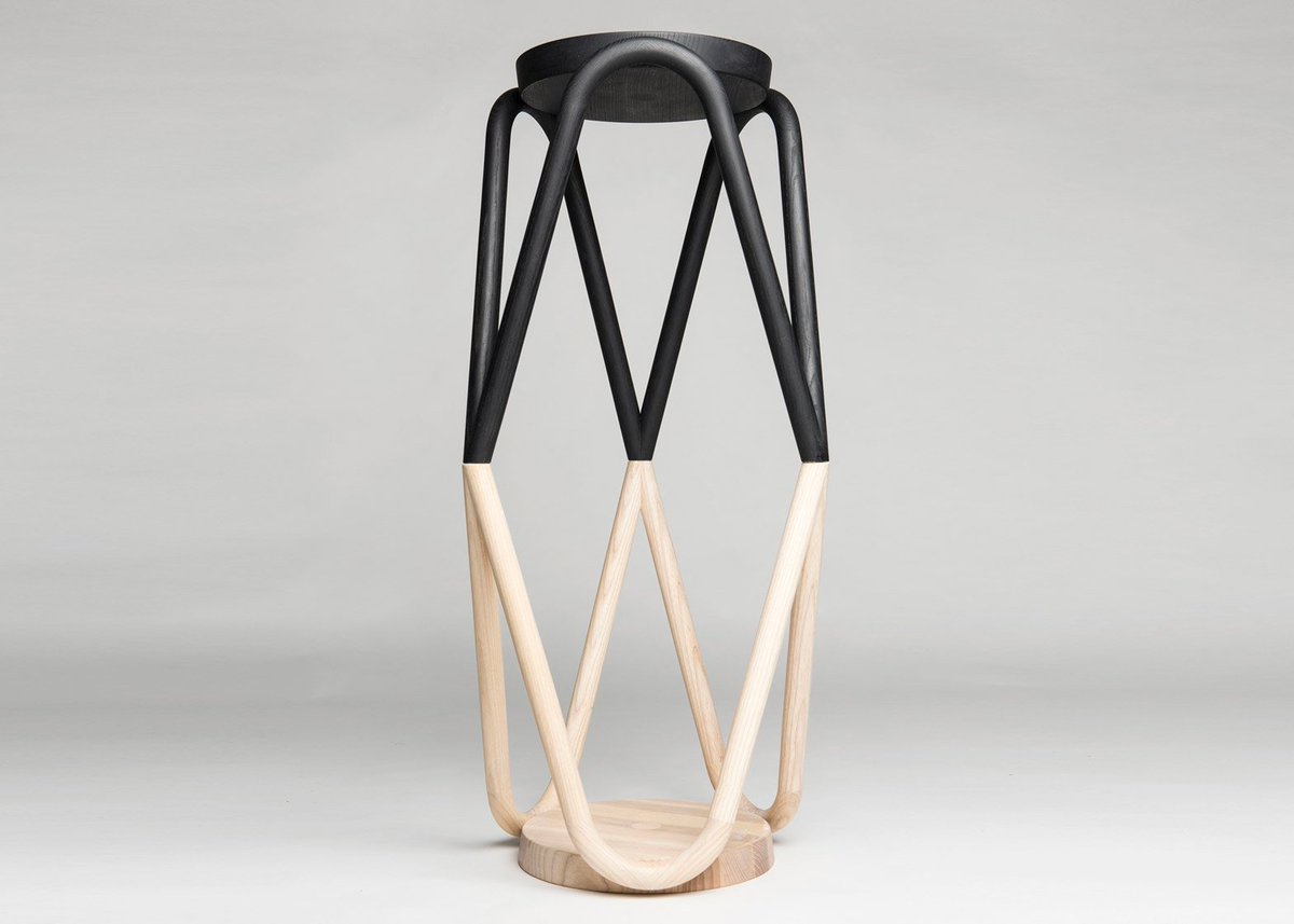 dezeen's tweet photo. Stackable stool with legs that form an undulating wooden support around its seat: https://t.co/YZrHnnTQd3 #design https://t.co/feliW1OiK5