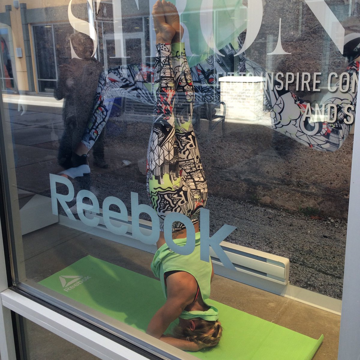 ReebokCanada's tweet photo. Yoga in the window of the Reebok store in Halton Hills today for the #ExpressYourStrong event! https://t.co/bXOo52B9Xj