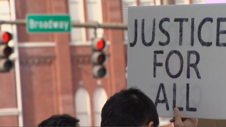 AlexBrownKC's tweet photo. Demonstrators gathered on Broadway in #Nashville to protest the conviction of Peter Liang #Justice4Liang https://t.co/kpmcmhWv5p