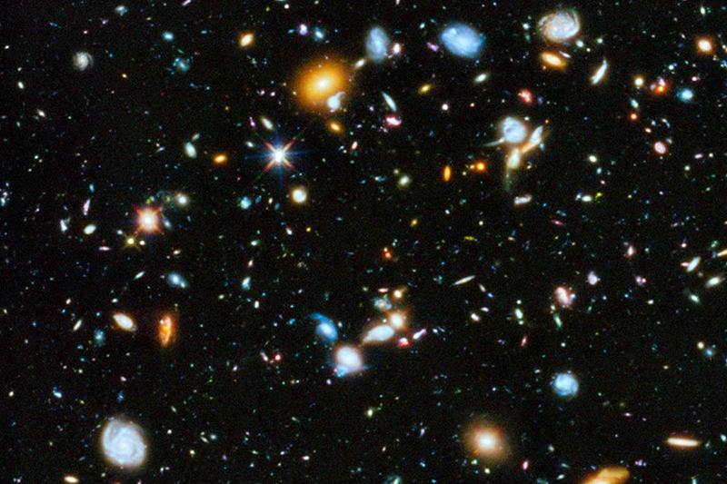 Discovery's tweet image. Hubble showed us 10,000 galaxies in one  tiny image of the sky. What will we discover next? #Telescope