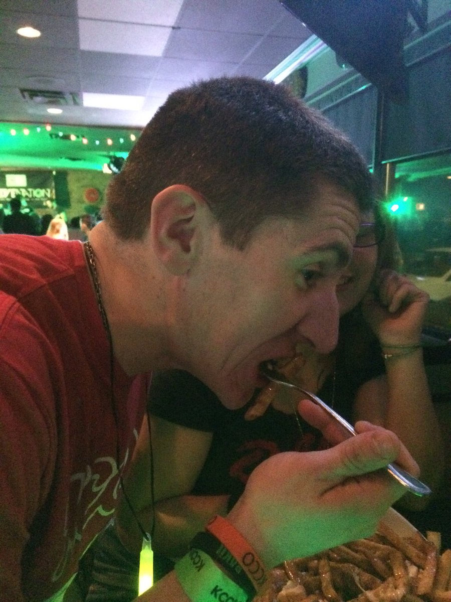 MissMandah's tweet photo. A momentous event: an American trying Poutine for the first time. @856Kcco #yycmeetup5 https://t.co/j1tGYsqBrs