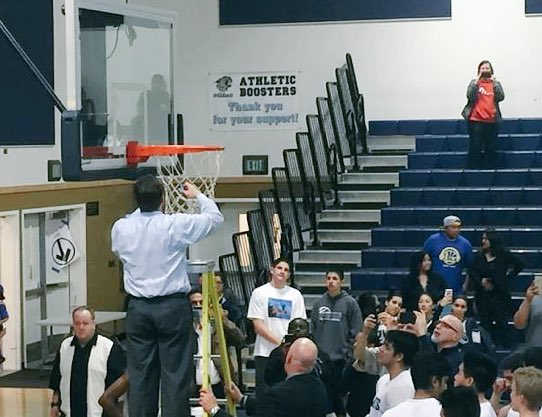 Section925's tweet photo. Coach Mike Hansen of #DoughertyValley cuts down the nets after winning the 2016 DFAL title. https://t.co/uBN7VS3haO