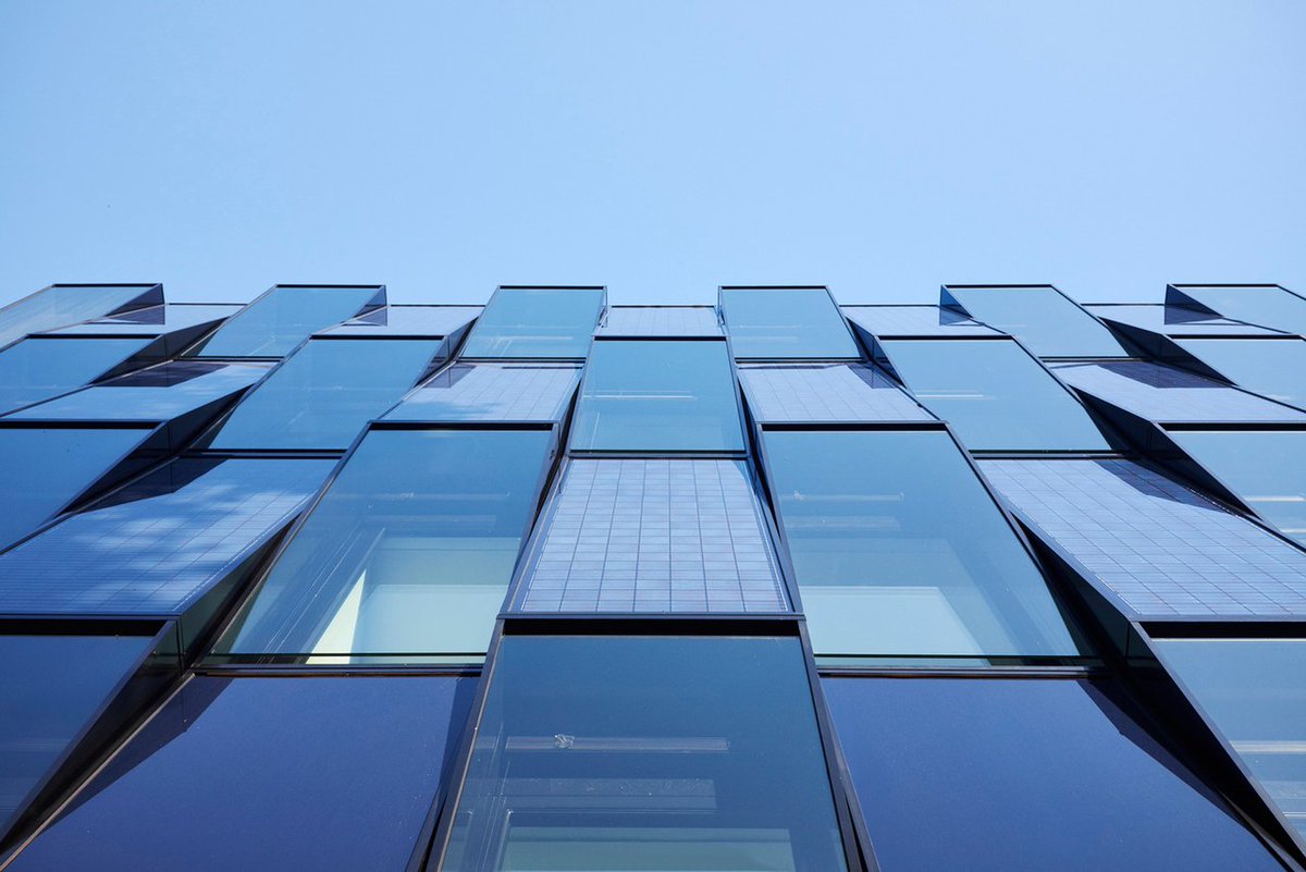 Solar panels and blue glass wrap this new eco-conscious building in Germany curbed.com/2016/3/7/11174…