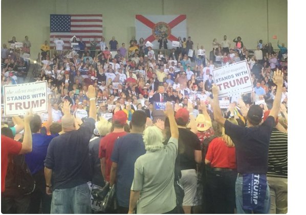 haaretzcom's tweet photo. WATCH: Trump makes crowd raise right hand and swear to vote for him https://t.co/GKc0RrqnjL https://t.co/wpIXPu8ICv