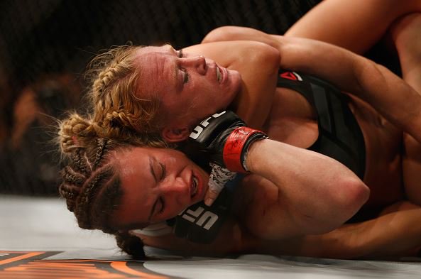 FindinMyNewNorm's tweet photo. Miesha upsets Holly Holm! New champ! #RondaRousey #HollyHolm #MieshaTate #UFC196 #SuperSaturday #HouseOfCards https://t.co/kLTbMyLad3