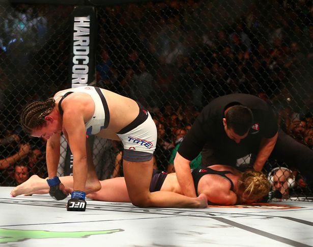 Miesha Tate beats Holly Holm in UFC 196 upset with blistering five-round win bit.ly/1M0Qwu6