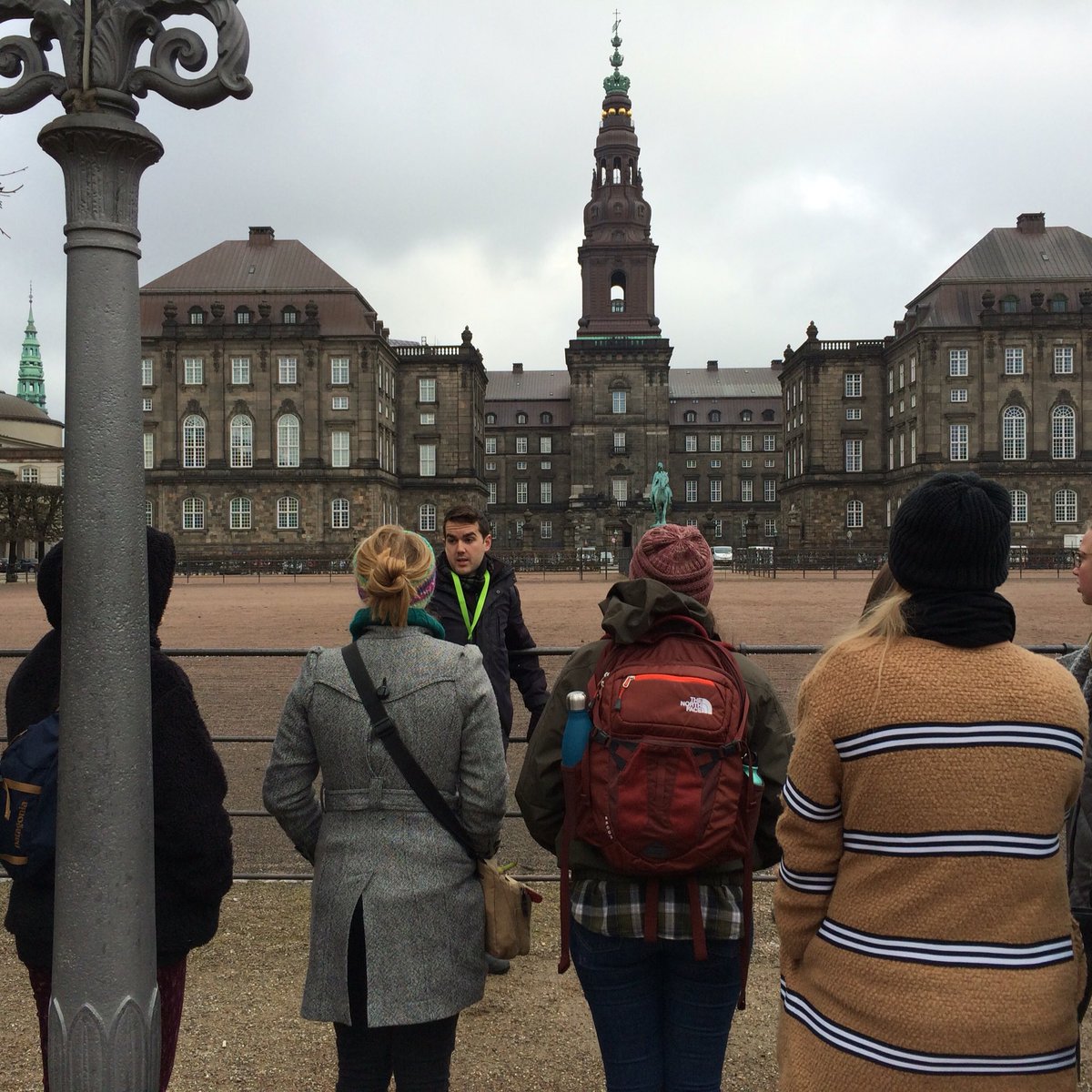CofCfyeabroad's tweet photo. Learning the history of the city at Christiansborg Palace with tour guide Benjamin #fyecph #cougsncope #bikingviking https://t.co/fJL1wjiBFd