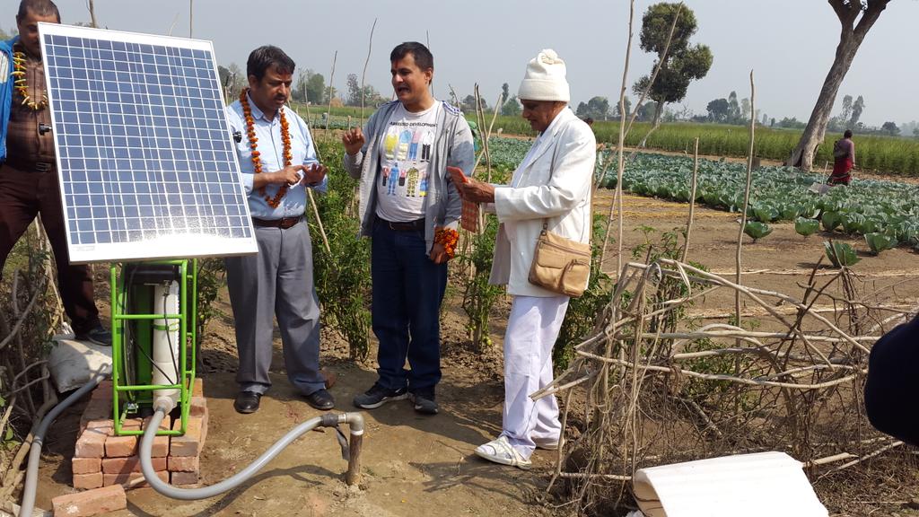 technology with poor farmers . Solar roar pump irrigateng vegetables garden at Kailali in Tharu community.