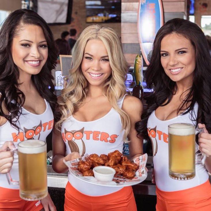 I'm at #hooters having lunch when some guy bitting into a #Hanburger s...