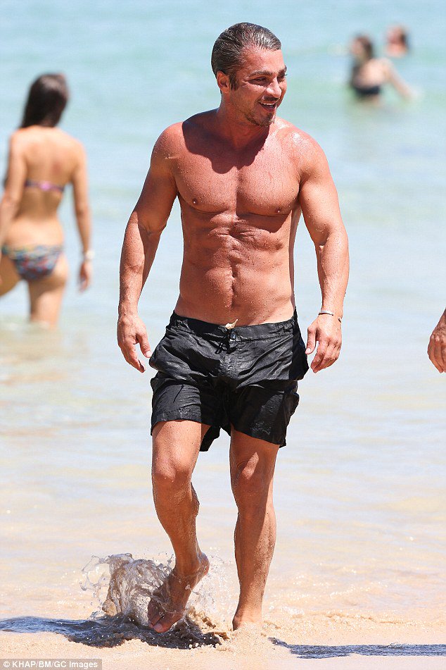 John ibrahim cools off at bondi beach showing off the scar ...