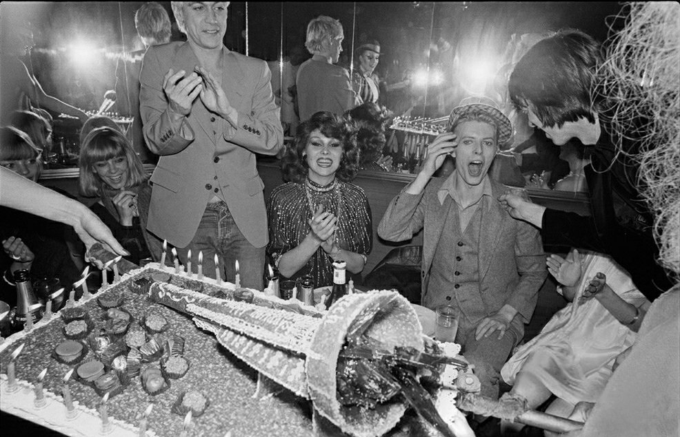 Iggy Pop, Romy Haag, David Bowie, Pat Gibbons and Coco Scwab (obscured), L'Ange Bleu, Paris, January 8, 1977