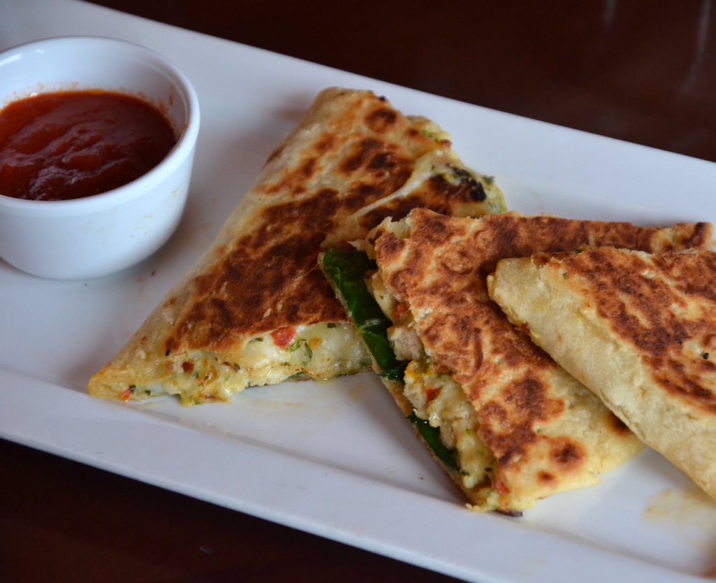 olivegarden's tweet photo. This is a Piadina. It's got grilled 🐓, spinach and Italian 🧀, all wrapped up together. So much yas. https://t.co/0HjhOdfq67