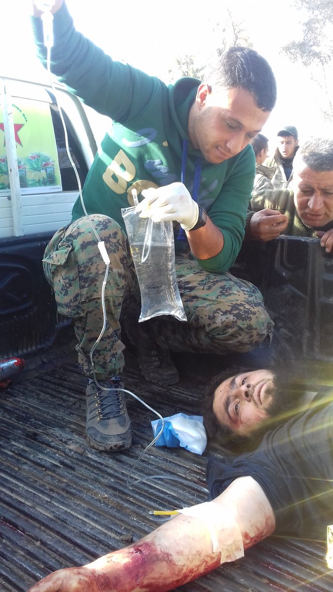 ara267954's tweet photo. #Daesh #ISIL member receiving treatment by #YPG medical team as he was captured during #QSD operation against them https://t.co/DJRrjyLnI4