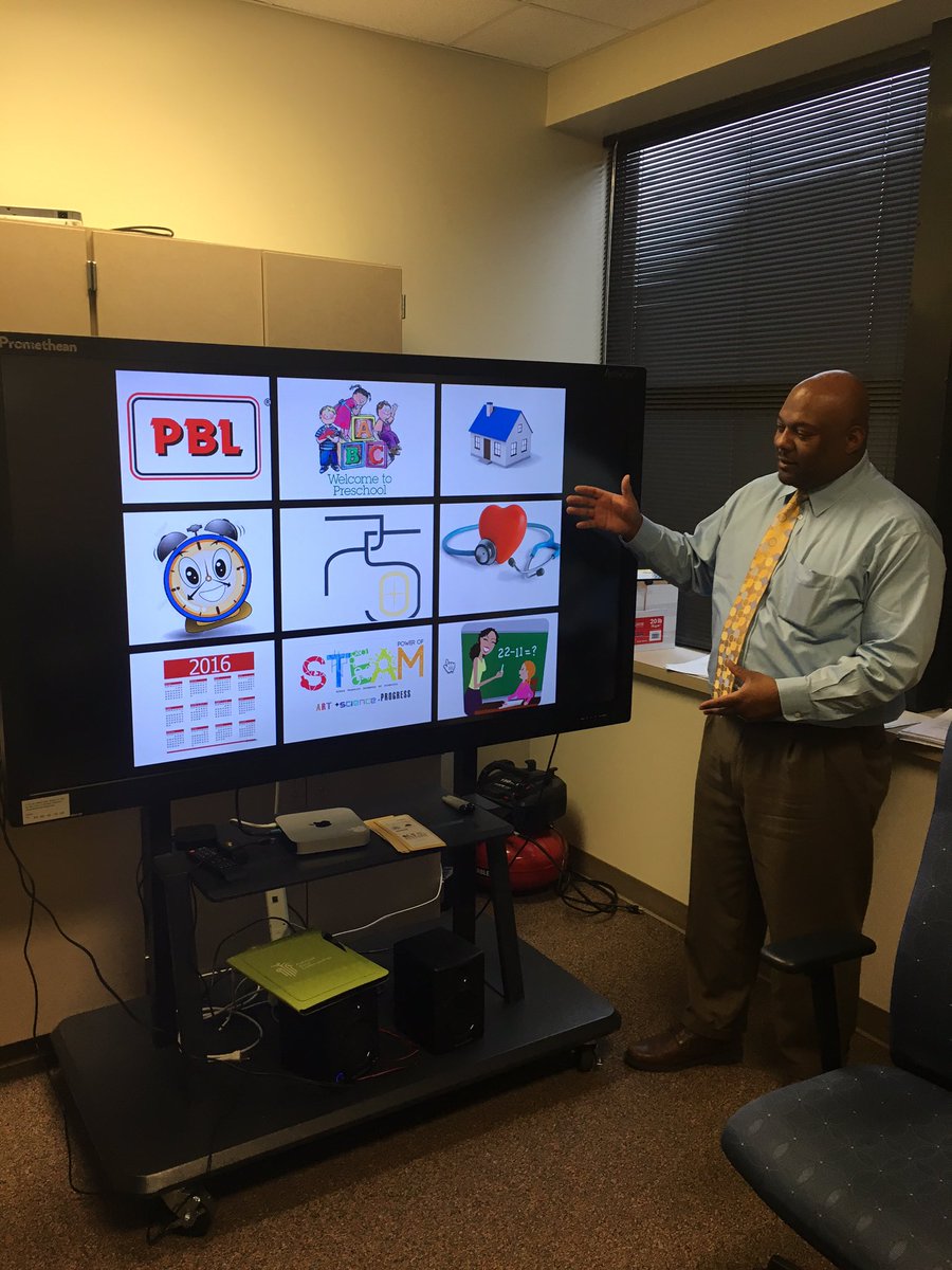 seventy5north's tweet photo. Howard Kennedy principal Tony Gunter demonstrating a new game at parent-teacher conferences #75N https://t.co/iwvHLLAOhw