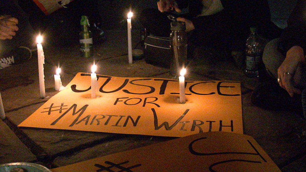 OccupyDenverBot's tweet photo. RT @madamecp At a memorial for #MartinWirth outside Tattered Cover tonight. #OccupyDenver https://t.co/eIlrxyKTHw