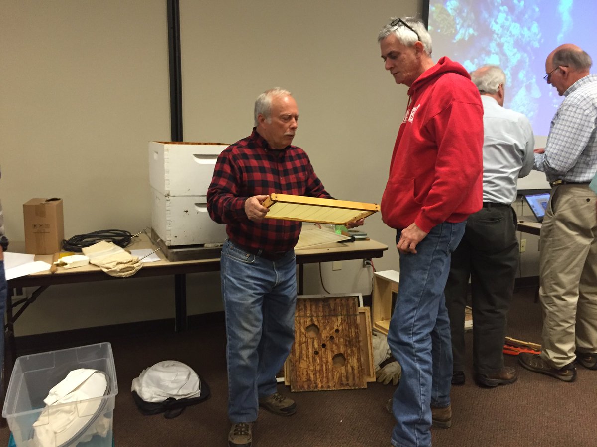 tlentz13's tweet photo. Bee class takes a break. Future beekeepers look at the equipment and ask questions of the presenters. #nkybees https://t.co/p4aA7qsriR
