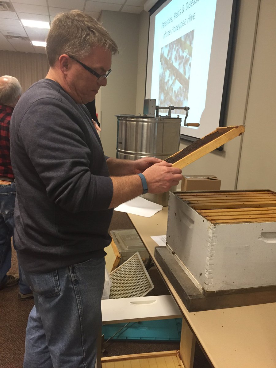 tlentz13's tweet photo. David Rose checks out a frame. Rose bought bees for the first time and will install them soon. #nkybees https://t.co/Fs4dYqSSfq