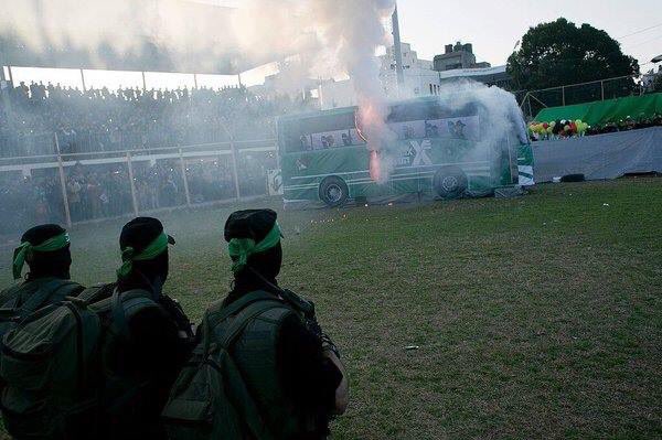 michaeldickson's tweet photo. The #Palestinian crowd in #Gaza enjoys a "show" of an Israeli bus being blown up. Sick.  
ht: @LTCPeterLerner https://t.co/eqLBYLq8gf