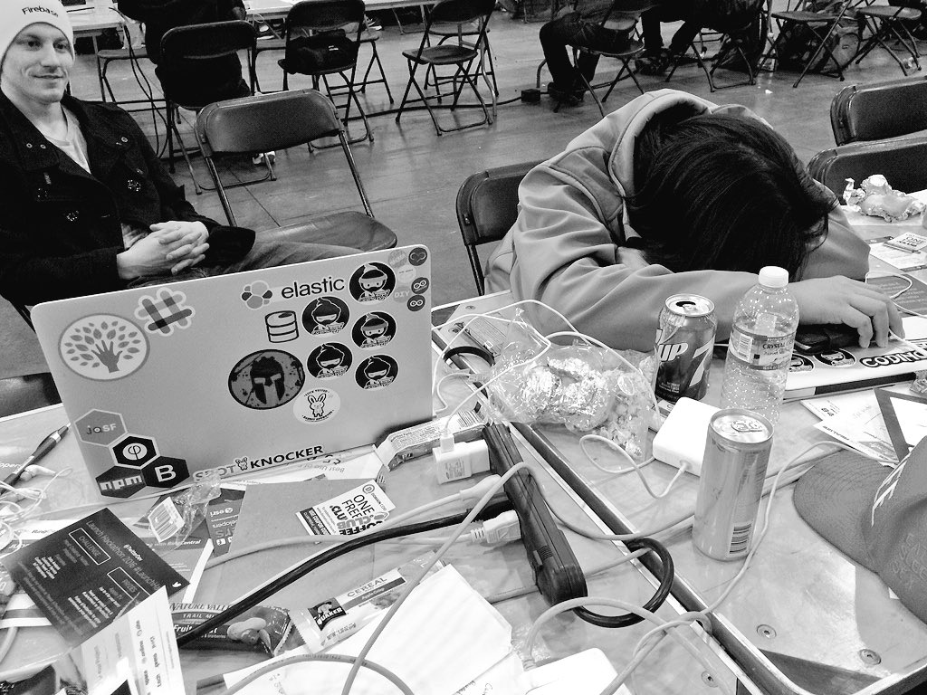 partyheer's tweet photo. Desks are for naps now at #launchhackathon https://t.co/tKTzQJFqbW