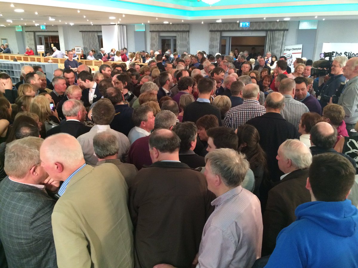 NewsonNS's tweet photo. Scrum around Tony McLoughlin and Eamon Scanlon who are expected to take the last two seats #slsdwc https://t.co/btD82fbMPK