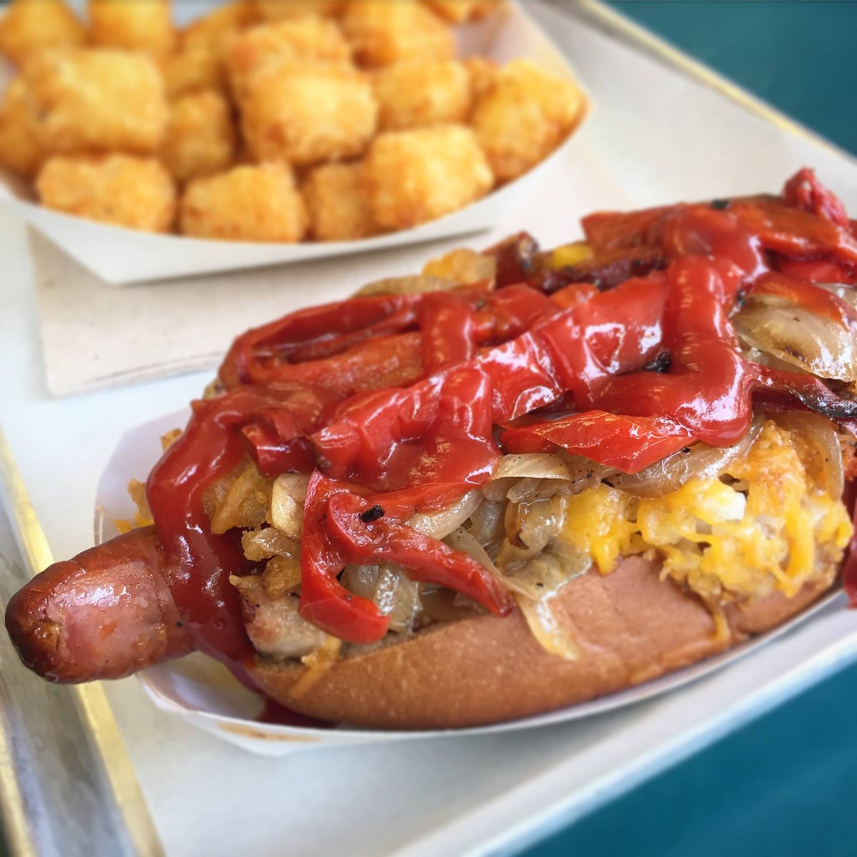 Could really go for another #SnappyOBrien dog right now: smash browns, cheese, onions, red peppers &amp; sous vide bacon