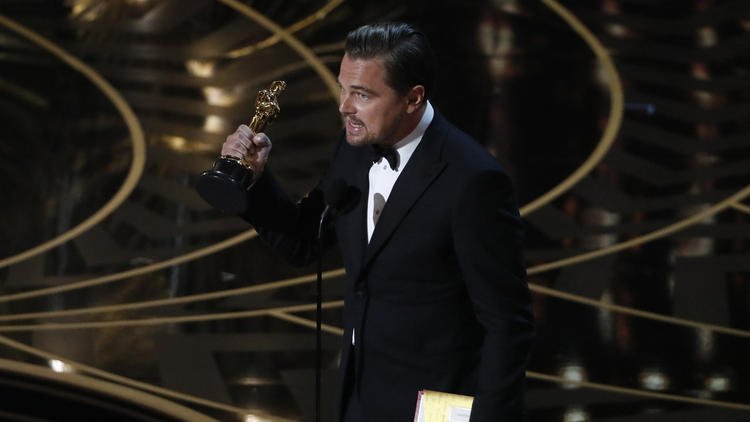 latimes's tweet photo. Leonardo DiCaprio doesn't take his lead actor Oscar -- or this planet -- for granted https://t.co/4Ybh7Dh61i https://t.co/diI3719pkJ