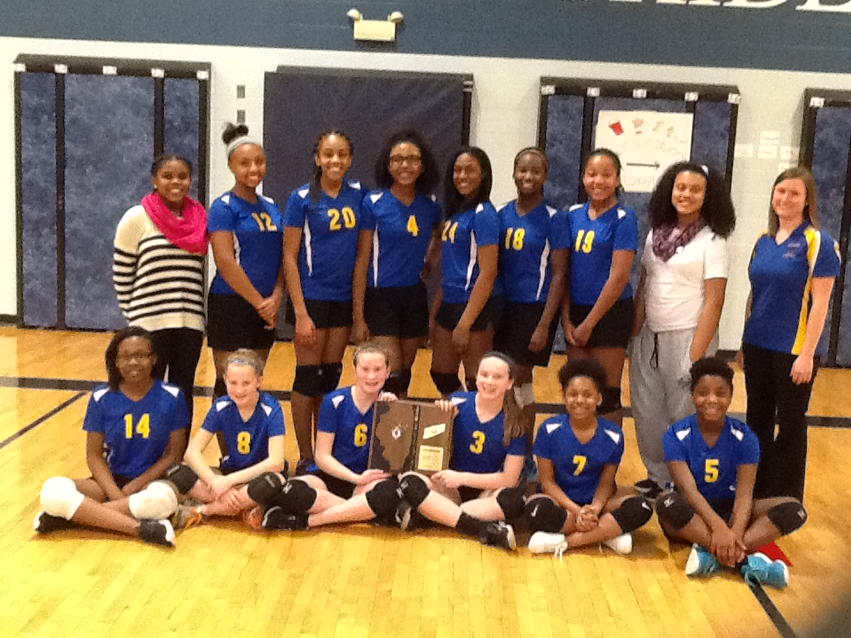 Parker 7th grade girl's volleyball team shows off the IESA Sectional trophy.
