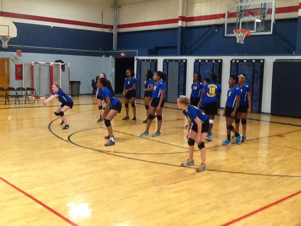 Parker 7th grade girl's volleyball team warms up before the IESA sectional game.