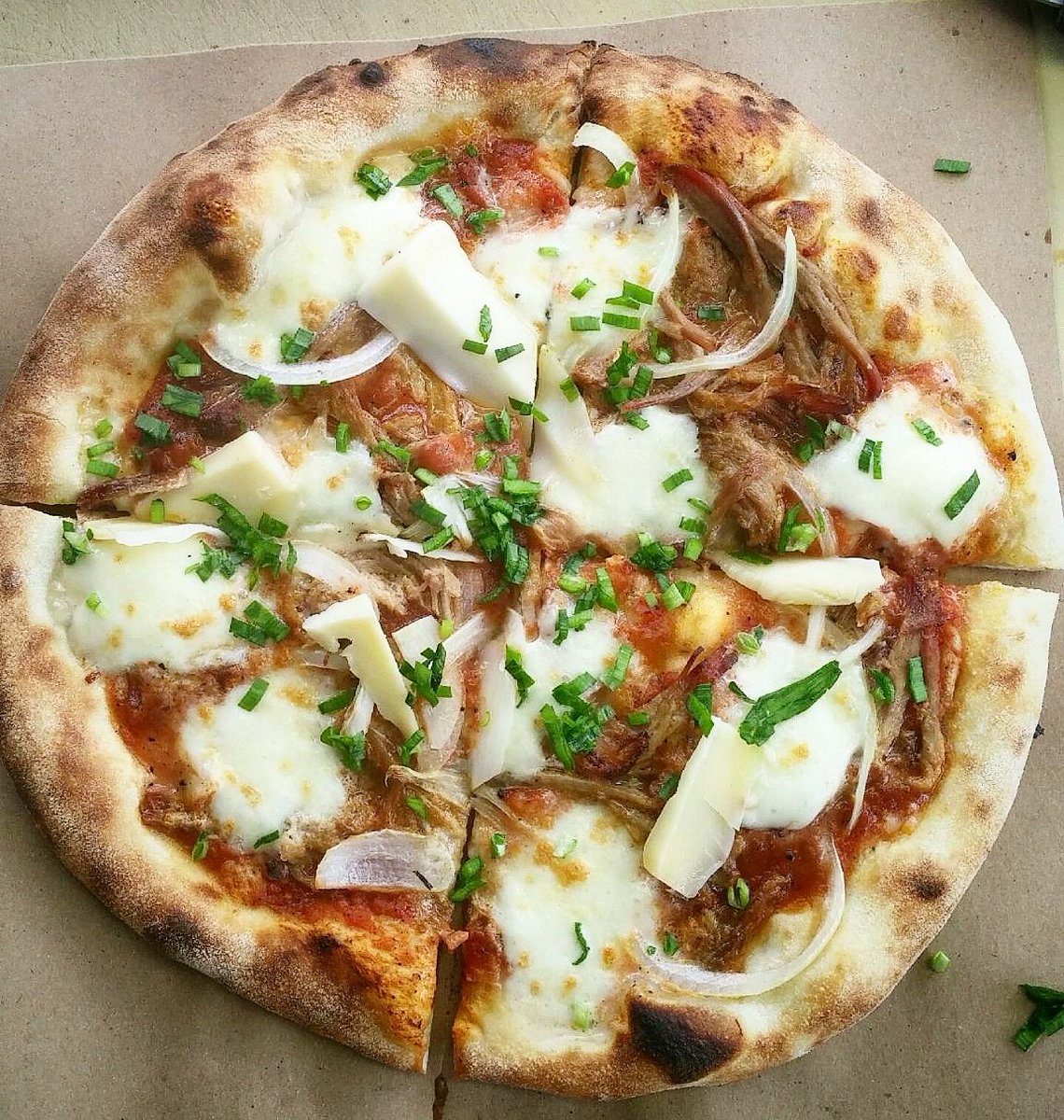 ASHwoodfired's tweet photo. This weeks #meat #pizza ... @thehotboxca  pulled BBQ pork, red onion, guoda, mozz, garlic chives #Portland #pdxeats https://t.co/1e5TfxJNxq