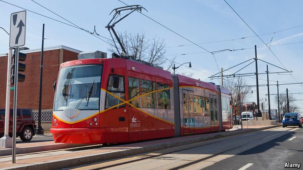 TheEconomist's tweet photo. Washington, DC's pointless streetcar service finally opens https://t.co/vg2JjYk4Of https://t.co/7Vn26WQSpZ