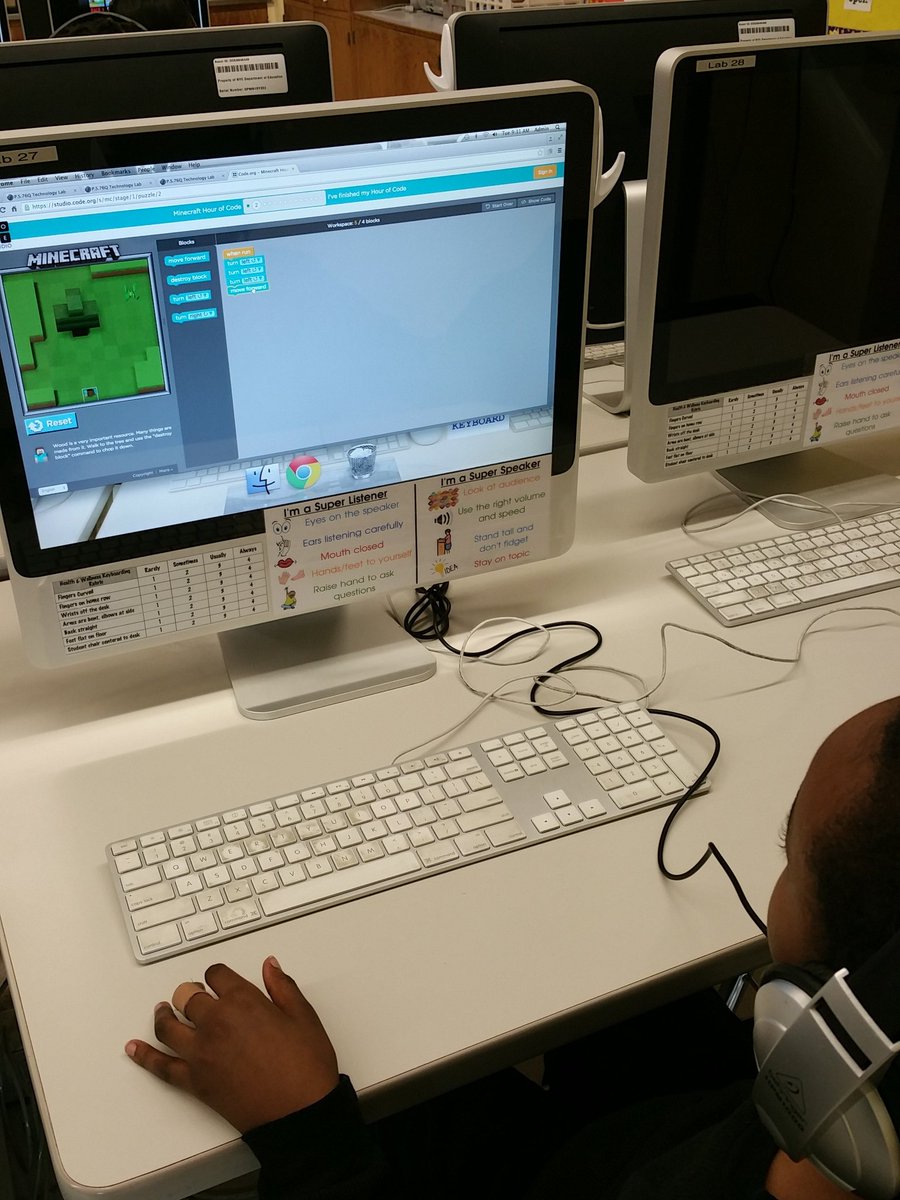 Second grader having fun coding Minecraft on Code.org.