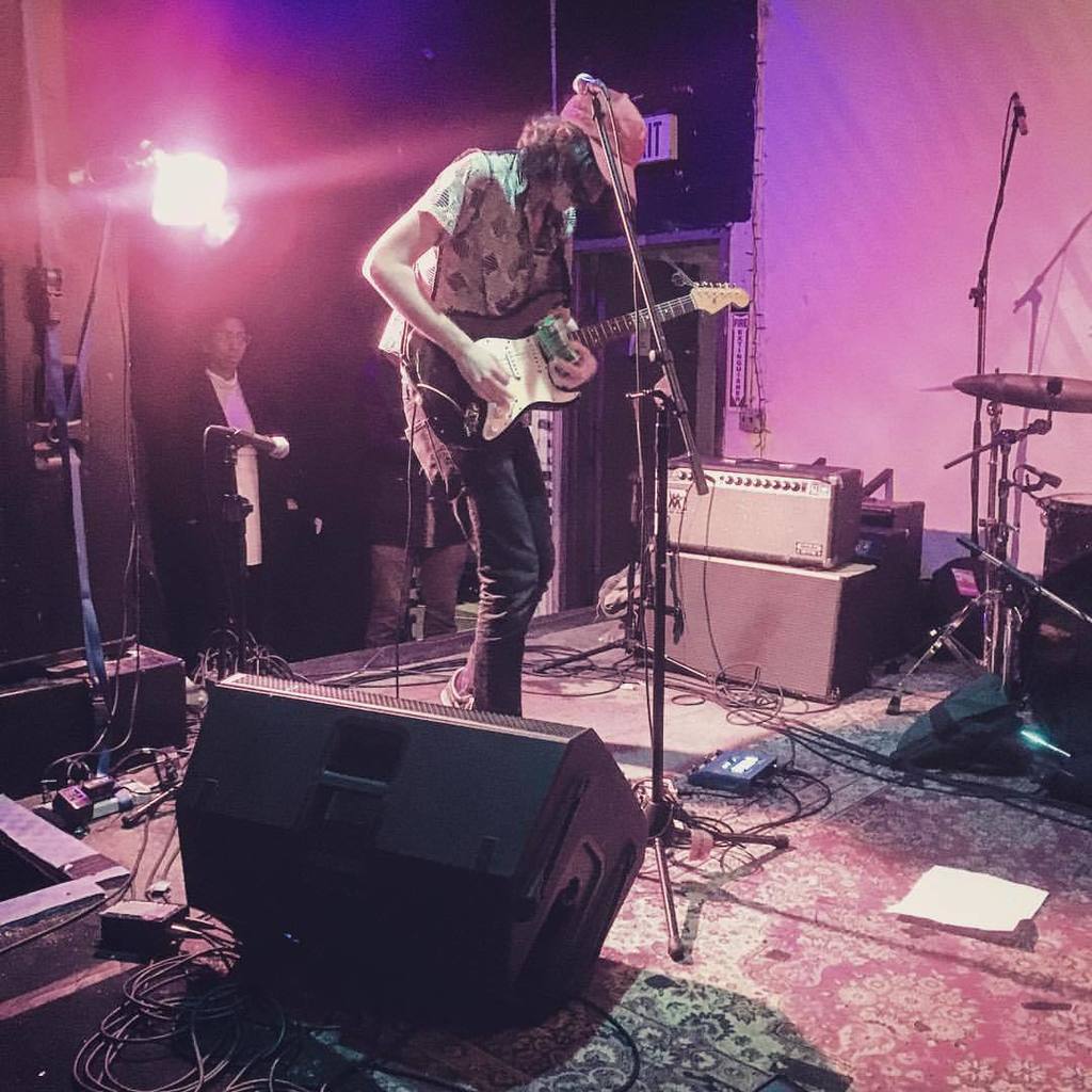 Sam Owens of <a href="/celestialshore/">Celestial Shore</a> shredding with a can of beer. Tactical Decisions! (at Shea Stadium)