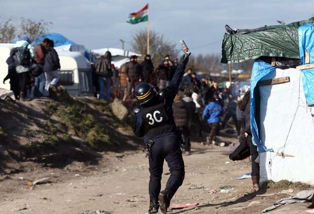 OccupyToronto's tweet photo. Grenades and water cannons used against refugees in Calais - https://t.co/Gj9vzDFx0Y #ows #france @OccupyParis https://t.co/EGw8cjgkuI
