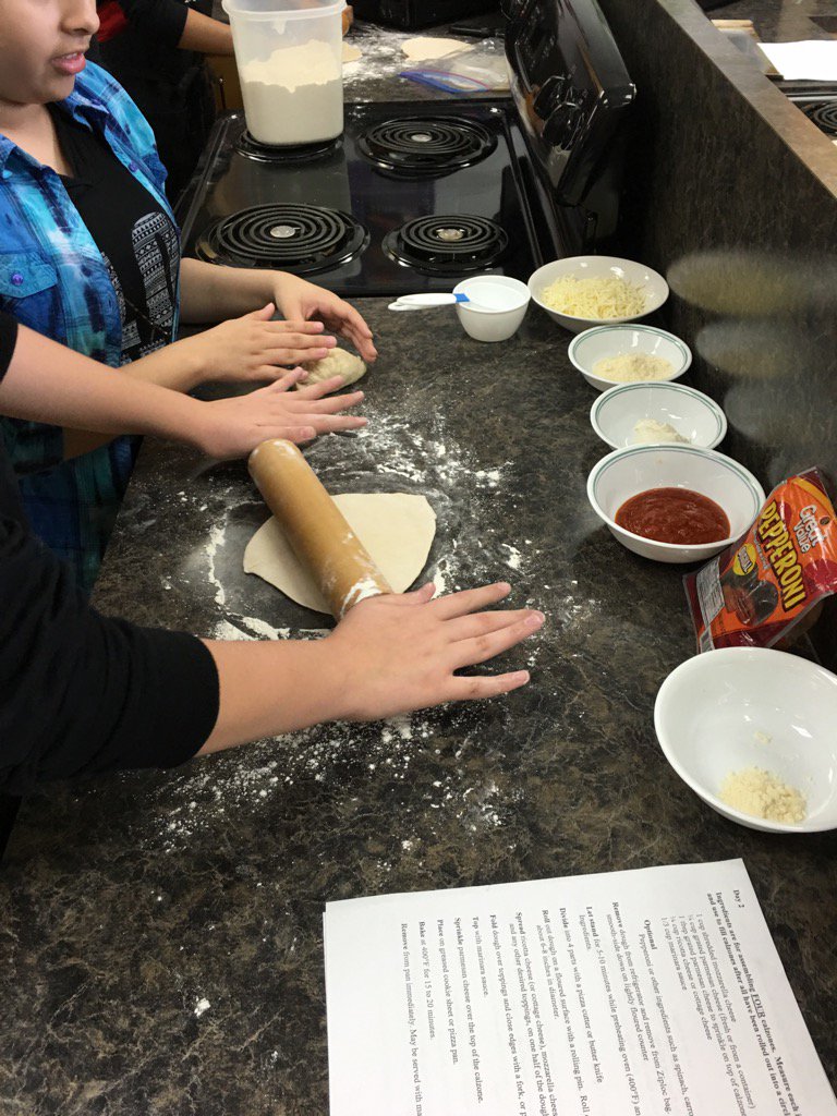 Bowman CTE students roll out the yeast dough they made yesterday to stuff and bake their calzones today! #theBow