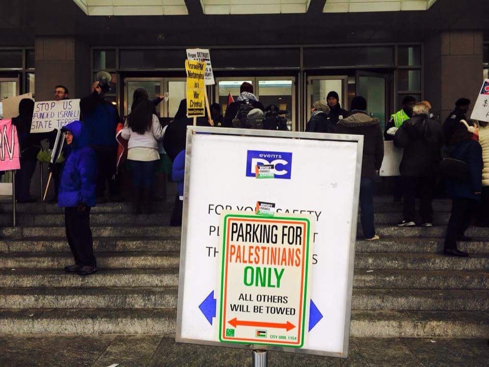 JaneVoter's tweet photo. My favorite parking sign from #ShutDownAIPAC rally in #DC2015 Zionists' were so confused! 😜👏😜 #Palestine 👍 https://t.co/8IkglrZFpN