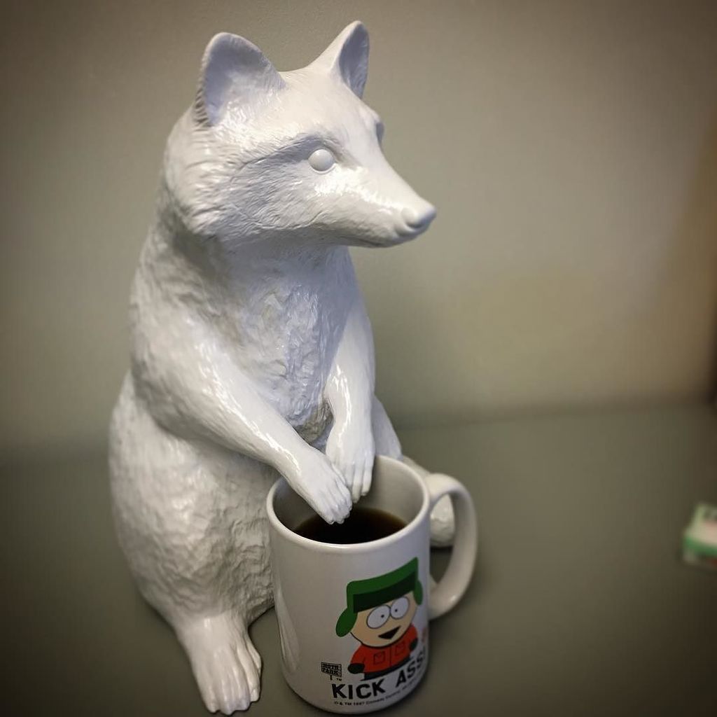stuffandymakes's tweet photo. Out of my coffee cup, @thumperer raccoon!!! @meltmedia office statues gone wild. #officefuntimes https://t.co/ofm10Iqyd5