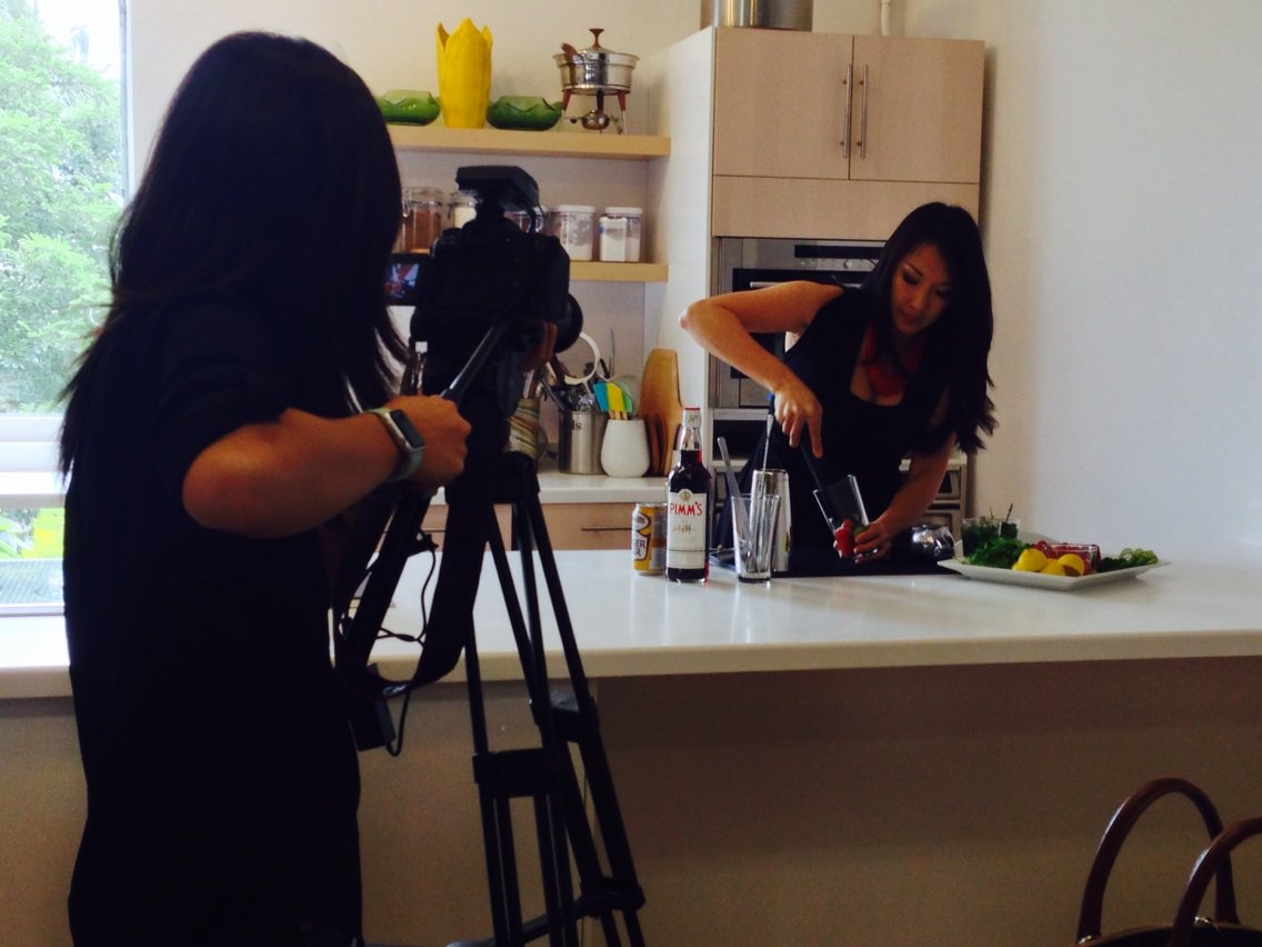 Chandra mixes a drink for the camera